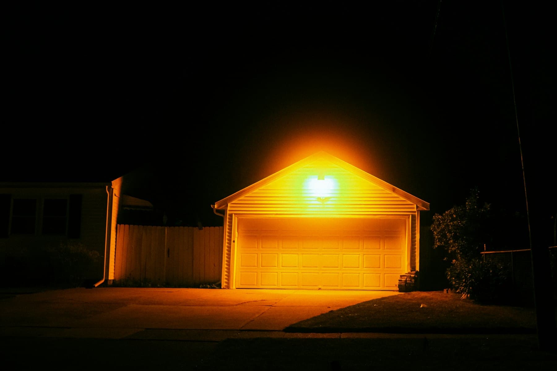 Dark garage door on a brick home